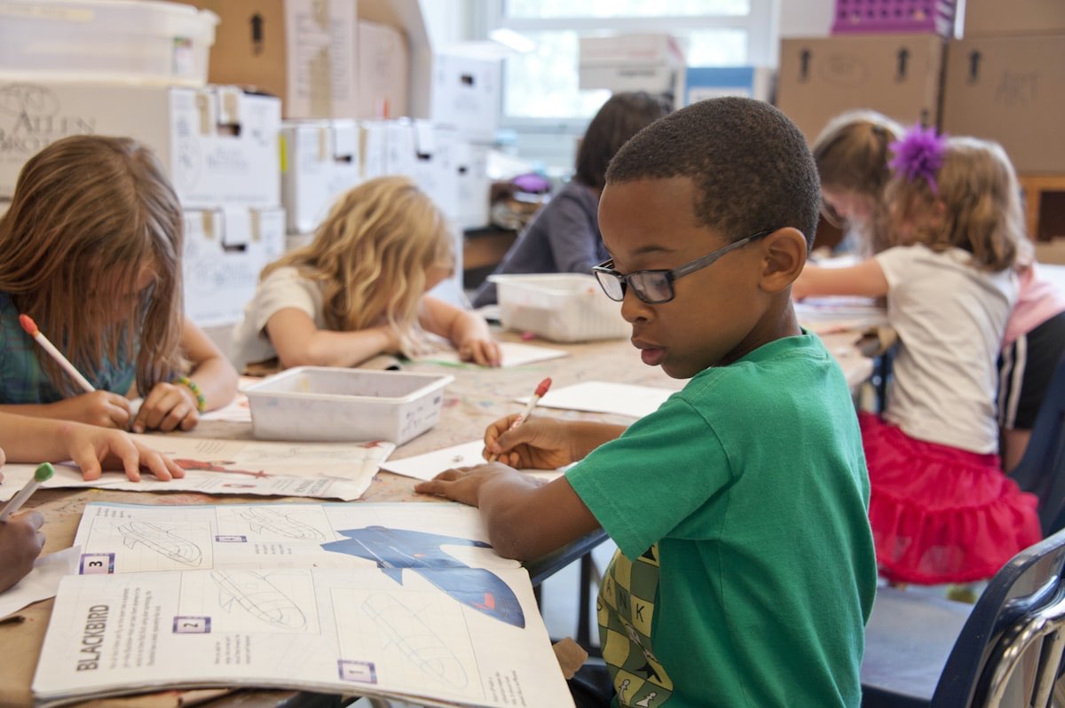 Young student focused on a writing exercise